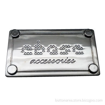 Metal alloy label with rack plating